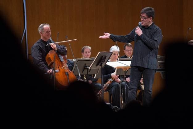 March 7, 2015 - Manhattan, New York, U.S. - ALAN GILBERT acknowledges cellist Eric Bartlett prior to conducting the New York Philharmonic in an all-Nordic program, Grace Rainey Rodgers Auditorium, Metropolitan Museum of Art, Saturday, March 7, 2015. Manhattan U.S. - ZUMAb09_