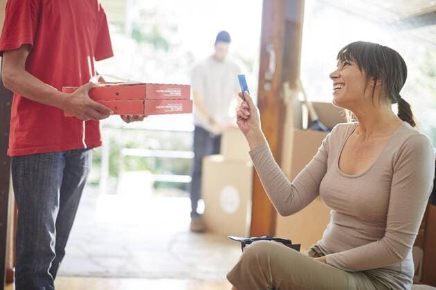 Couple moving house, collecting a pizza order model released Symbolfoto property released  ZEF002844