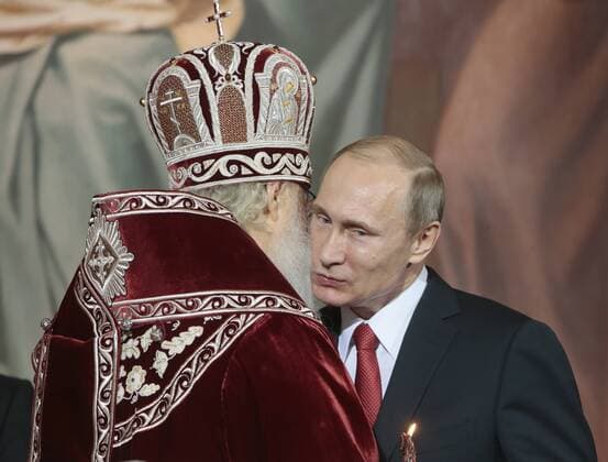 MOSCOW, RUSSIA. APRIL 12, 2015. Patriarch Kirill of Moscow and all Russia (L) and the president of Russia, Vladimir Putin, greet each other at an Orthodox Easter liturgy at the Cathedral of Christ the Saviour. Mikhail Metzel TASS  RE16116F