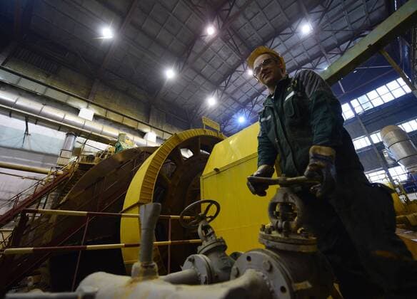 SAKHA, RUSSIA. APRIL 20, 2015. An employee operating a mill at a crushing and chopping department of the Kuranakh gold extracting factory owned by AldanZoloto Mining Company. AldanZoloto is a subsidiary of Polyus Gold. Yuri Smityuk TASS  TS000940