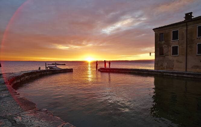Italy, Punta san Vigilio, sunset over Lake Garda  MRF001645