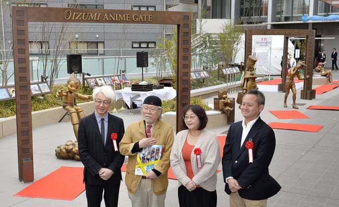 Life-size bronze statues of popular anime characters unveiled in Tokyo Renowned Japanese cartoonists Leiji Matsumoto (2nd from L) and Rumiko Takahashi (3rd from L) join other guests for a commemorative photo in front of the newly unveiled Oizumi Anime Gate, featuring life-size bronze statues of popular animation characters such as Astro Boy, at its opening ceremony in Tokyo s Nerima district on April 4, 2015. Nerima prides itself on being the birthplace of Japan s anime production industry. 
