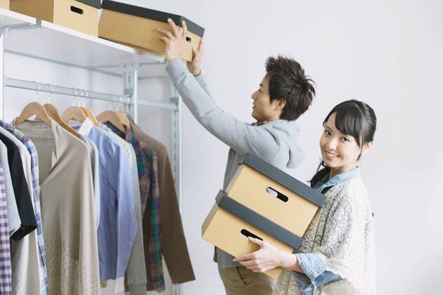 Young couple choosing clothes in a walk in closet  (jjig002726)