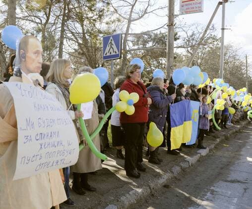 SIMFEROPOL, Ukraine - Tatars rally to call for peace near a naval base in Bakhchisarai, in the Autonomous Republic of Crimea in southern Ukraine, on March 5, 2014.  0306053