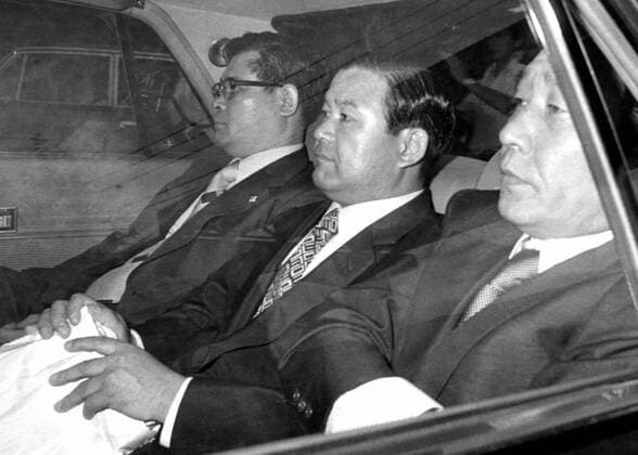 TOKYO, Japan - Former House of Representatives member Koko Sato (C) is transported to the Tokyo Detention House in August 1976 after being arrested over a high-profile bribery scandal involving Lockheed Corp. Sato died of biliary cancer on May 18, 2011, at the age of 83.  0519027
