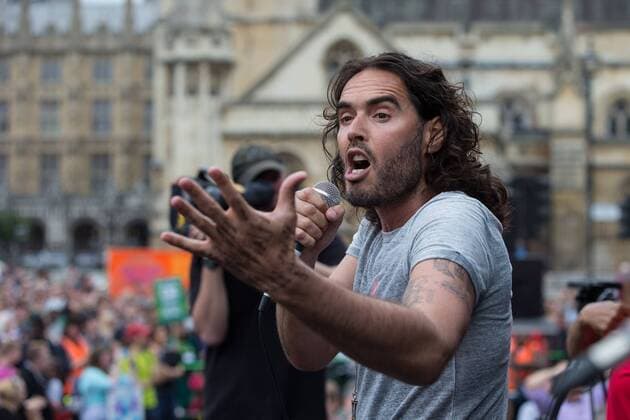 June 20, 2015 - London, Greater London, UK - London , UK . RUSSELL BRAND speaks in Parliament Square . Tens of thousands of people march from the Bank of England to Parliament , to protest economic austerity in Britain London UK  - ZUMAl94_