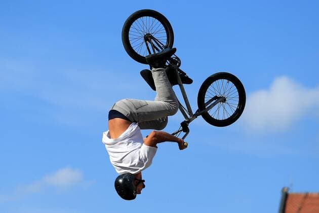 BMX jump over tram - Osijek, Croatia 20.06.2015., Osijek, Croatia - Famous professional BMX rider Igor Vukadinovic known as Poki jumped with his bike over the tram on Ante Starcevic Square.  DavorxJavorovic PIXSELL