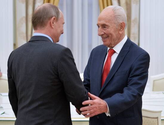 MOSCOW, RUSSIA. JUNE 23, 2015. Russia s President Vladimir Putin (L) and Israel s politician Shimon Peres shake hands at a meeting, at Moscow s Kremlin. Alexei Druzhinin Russian presidential press service TASS  TS006817
