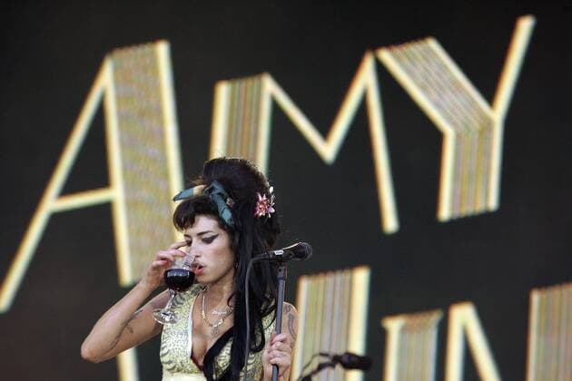 FILE - British siger Amy Winehouse performs on stage during the Rock in Rio music festival on July 4 , 2008 in Arganda del Rey near Madrid. Singer Winehouse, 27, was found dead at her Camden home on July 23, 2011.