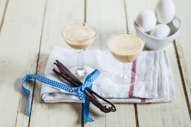 Two glasses of egg liqueur and vanilla beans on cloth  SBDF002025