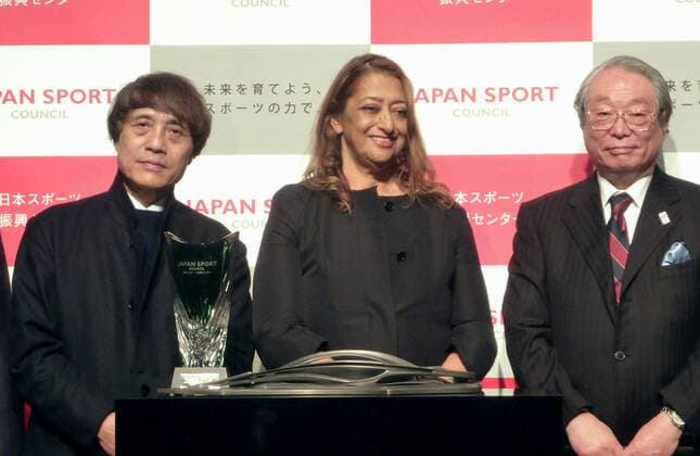 Architects Ando, Hadid Japanese architect Tadao Ando (L) and Iraqi-British architect Zaha Hadid (C) are shown in a file photo taken in March 2013 in Tokyo during the ceremony to award Hadid the top prize in a competition to design the new National Stadium in the Japanese capital. Ando chose her design as chairman of the design competition committee. 
