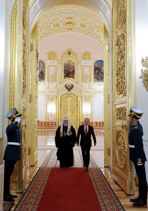 MOSCOW, RUSSIA. JULY 28, 2015. Patriarch Kirill (L) of Moscow and all Russia and Russia s President Vladimir Putin arrive at a reception marking the 1000 years since the repose of St. Vladimir the Great. Mikhail Klimentyev Russian Presidential Press and Information Office TASS  TS008918