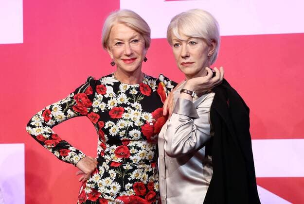 July 30, 2015 - London, England - Actress Dame Helen Mirren poses with three of her wax works figures at Madame Tussauds on July 30 2015 in London London England  - ZUMAny1_