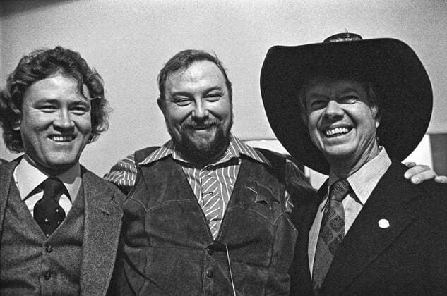 Jan. 1, 2015 - Atlanta, Georgia, USA - 1976 Democratic presidential nominee Jimmy Carter wears the hat of country music performer Charlie Daniels (middle). At left is Carter friend and early supporter, Phil Walden, founder of Capricorn Records of Macon, Georgia. Daniels was playing a fundraiser at Atlanta s historic Fox Theater to benefit Carter s campaign. Atlanta USA - ZUMAkh1_
