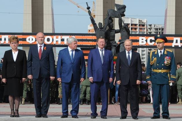 CHITA, RUSSIA. SEPTEMBER 2, 2015. Russia s President Vladimir Putin (2nd R), Transbaikal Territory Governor Konstantin Ilkovsky (2nd L) and Kremlin s Chief of Staff Sergei Ivanov (3rd R) pose for a photograph during a wreath laying ceremony at the WWII Memorial in Chita on the day of the 70th anniversary of the End of World War II. The monument was opened on May 9, 1975, in memory of the Transbaikal Territory residents killed in WWII. Mikhail Klimentyev Russian Presidential Press and Information Office TASS  TS00C3E1