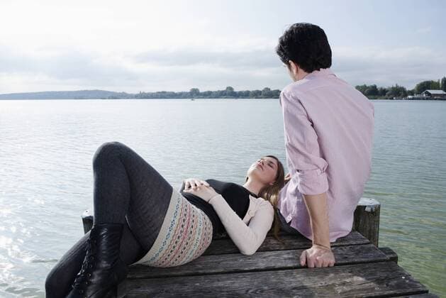 Young couple lake water jetty relaxing mit_2002_06262