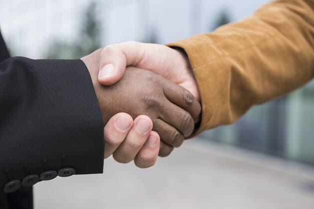 Hand shake businessmen African Caucasian close up mit_2002_06329
