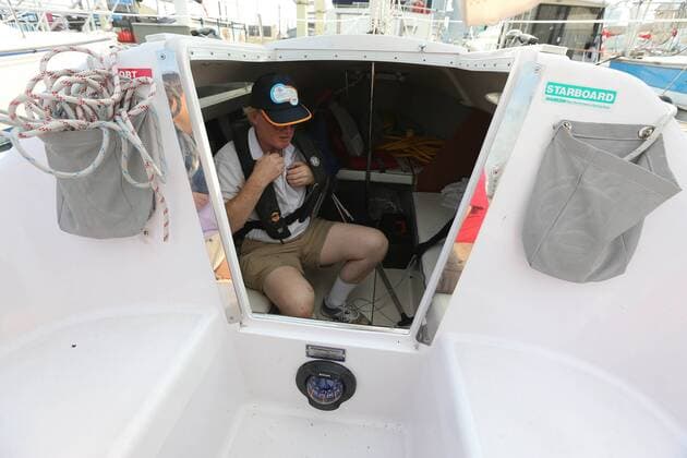 Sept. 3, 2015 - Toronto, ON, Canada - TORONTO, ON- SEPTEMBER 3 - David Brown puts on his life jacket before a training sail in Humber Bay. David Brown is a blind sailor from Toronto who nest week will compete at the world championships in Chicago. He competes with another blind sailor Brian Arthur and with the help of two others who will guide them. in Toronto Harbour in Toronto. September 3, 2015. Toronto Canada  - ZUMAt14_