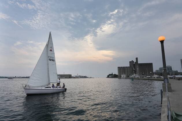 Sept. 3, 2015 - Toronto, ON, Canada - TORONTO, ON- SEPTEMBER 3 - David Brown and his training partners prepare to head out to open water through the Western Gap as they to go out on Humber Bay for a training sail with Bruce Arthur, left, and Chris Jonas. David Brown is a blind sailor from Toronto who nest week will compete at the world championships in Chicago. He competes with another blind sailor Brian Arthur and with the help of two others who will guide them. in Toronto Harbour in Toronto. September 3, 2015. Toronto Canada  - ZUMAt14_