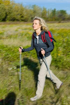 WELLNESS UND GESUNDHEIT Nordic Walking - Model release Woman on excursion.  1271212