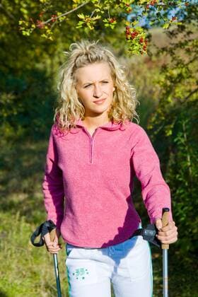 WELLNESS UND GESUNDHEIT Nordic Walking - Model release Woman on excursion.  1271241