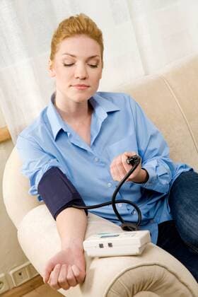 Woman measuring herself blood pressure.  1272345
