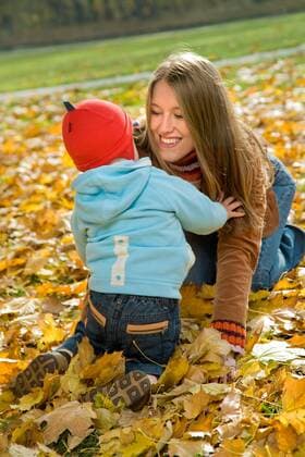 Boy spending time with his mother in park.  1275813