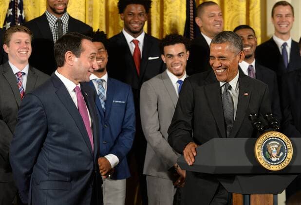 U.S. President Barack Obama shares a laugh with Duke head basketball coach Mike Krzyzewski during a celebration event in the East Room of the White House in Washington, DC on September 8, 2015. The Duke Blue Devils won the NCAA college basketball championship in March of 2015.  WAP2015090801 PATxBENIC