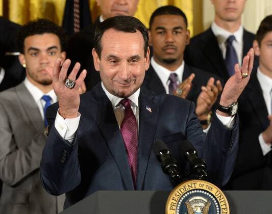 Duke head basketball coach Mike Krzyzewski asks everyone to stand to honor President Barack Obama during a celebration event in the East Room of the White House in Washington, DC on September 8, 2015. The Duke Blue Devils won the NCAA college basketball championship in March of 2015.  WAP2015090805 PATxBENIC