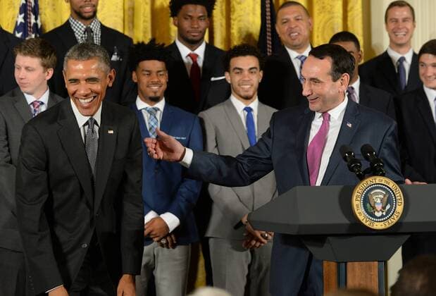 U.S. President Barack Obama shares a laugh with Duke head basketball coach Mike Krzyzewski during a celebration event in the East Room of the White House in Washington, DC on September 8, 2015. The Duke Blue Devils won the NCAA college basketball championship in March of 2015.  WAP2015090806 PATxBENIC