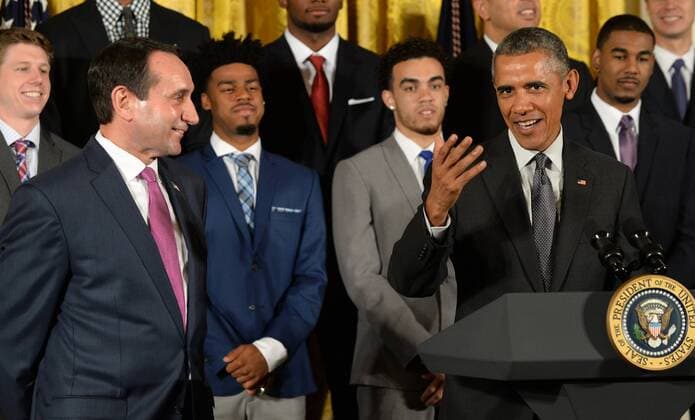 U.S. President Barack Obama shares a laugh with Duke head basketball coach Mike Krzyzewski during a celebration event in the East Room of the White House in Washington, DC on September 8, 2015. The Duke Blue Devils won the NCAA college basketball championship in March of 2015.  WAP2015090802 PATxBENIC