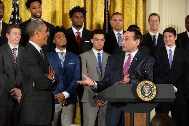 U.S. President Barack Obama shares a laugh with Duke head basketball coach Mike Krzyzewski during a celebration event in the East Room of the White House in Washington, DC on September 8, 2015. The Duke Blue Devils won the NCAA college basketball championship in March of 2015.  WAP2015090808 PATxBENIC