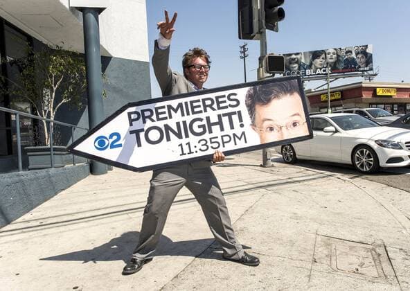 Sept. 08, 2015 - Los Angeles, California, U.S. - AArow Advertising sign spinner KOREY MENDENHALL calls attention to the premiere tonight of The Late Show with Stephen Colbert. Los Angeles U.S. - ZUMAce6_