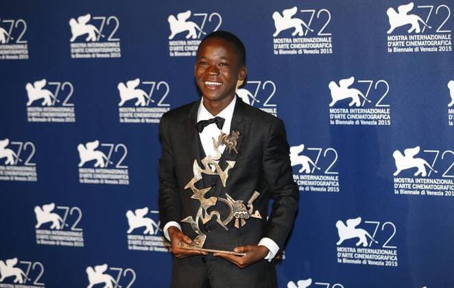 (150912) -- VENICE, Sept. 12, 2015 -- Actor Abraham Attah poses with the Marcello Mastroianni Award to a Young Actor for Beasts Of No Nations , as he attends the award winners photocall during the 72nd Venice Film Festival, at the Lido of Venice, Italy, Sept. 12, 2015. ) ITALY-VENICE-FILM-FESTIVAL-72ND-AWARD YexPingfan 
