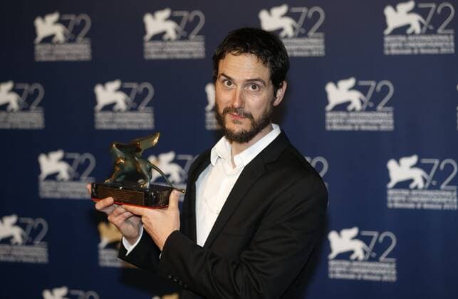 (150912) -- VENICE, Sept. 12, 2015 -- U.S. director Jake Mahaffy poses with the Orizzonti Award for Best Film for the movie Free in Deed , as he attends the award winners photocall during the 72nd Venice Film Festival, at the Lido of Venice, Italy, Sept. 12, 2015. ) ITALY-VENICE-FILM-FESTIVAL-72ND-AWARD YexPingfan 