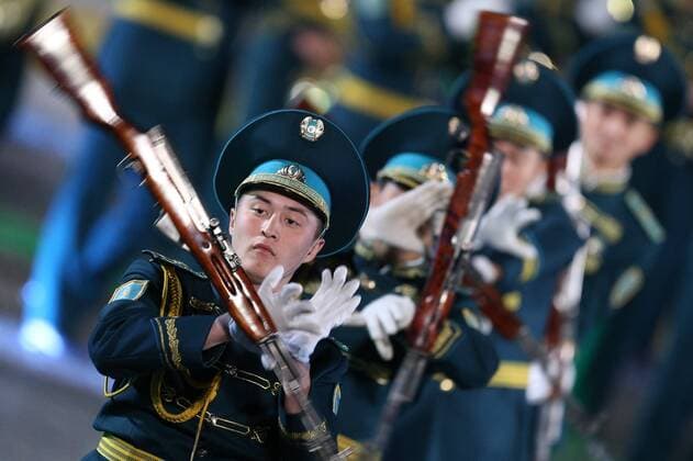 MOSCOW, RUSSIA. SEPTEMBER 13, 2015. Members of Kazakhstan s Squadron of Honor Guard and the Presidential regiment Band Aybyn perform during the closing ceremony for the 2015 Spasskaya Tower International Military Music Festival in Moscow s Red Square. Sergei Bobylev TASS  TS00D9DB