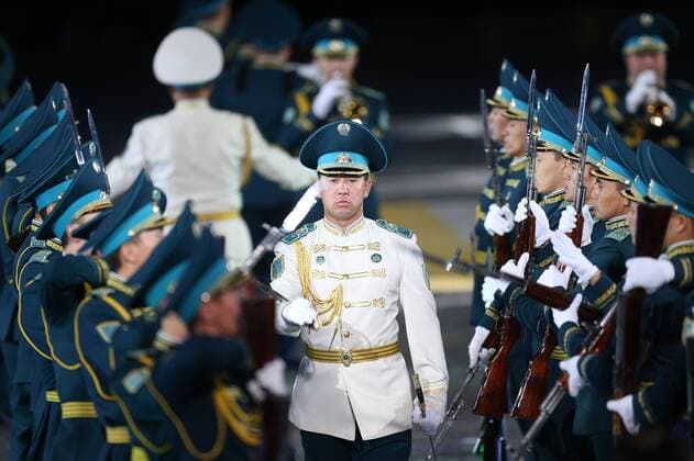 MOSCOW, RUSSIA. SEPTEMBER 13, 2015. Members of Kazakhstan s Squadron of Honor Guard and the Presidential regiment Band Aybyn perform during the closing ceremony for the 2015 Spasskaya Tower International Military Music Festival in Moscow s Red Square. Sergei Bobylev TASS  TS00D9DC