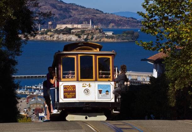 A POWELL and MARKET CABLE CAR with a view of ALCATRAZ ISLAND - SAN FRANCISCO, CALIFORNIA McPLOV McPLOV