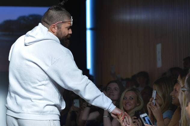 Josh Ostrovsky, aka The Fat Jew , greets an audience member just after the finale at a Dad Fashion show held during New York Fashion Week Spring Summer 2016 in New York City on September 16, 2015.  NYP201509162047 ANDREAxHANKS