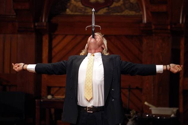 2007 Ig Nobel Prize winner Dan Meyer swallows a sword on stage during the 2015 Ig Nobel Prize ceremony at Harvard University in Cambridge, Massachusetts on September 17, 2015. The prizes which are awarded by the Annals of Improbable Research are intended to celebrate the unusual, honor the imaginative and spur people s interest in science, medicine, and technology.  BOS2015091709 MATTHEWxHEALEY