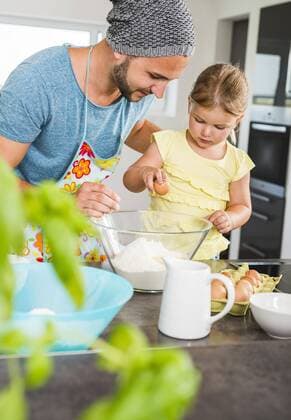 Father and daughter baking in kitchen model released Symbolfoto property released  UUF005165