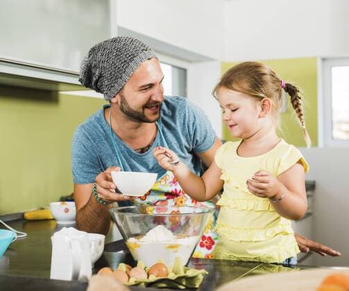 Father and daughter baking in kitchen model released Symbolfoto property released  UUF005171