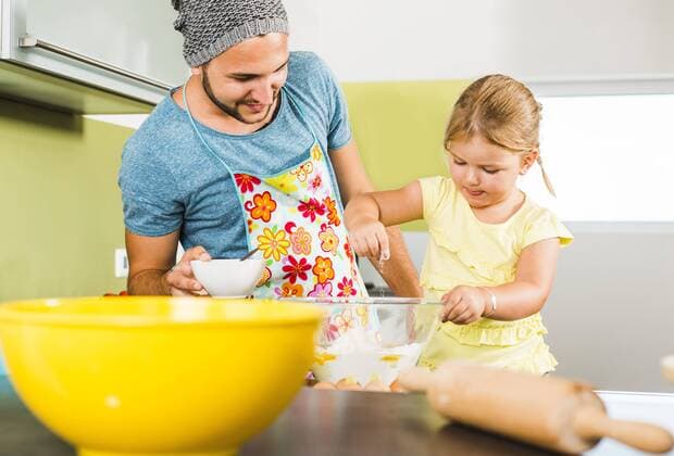 Father and daughter baking in kitchen model released Symbolfoto property released  UUF005210
