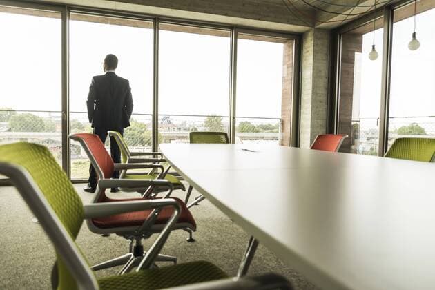 Conference room with businessman at the window model released Symbolfoto property released  UUF005407