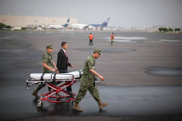 MEXICO CITY, Sept. 18, 2015 -- Soldiers prepare for the arrival of the plane carrying Mexican tourists injured in Egypt, at the Presidential Hangar at Mexico City s International Airport, in Mexico City, capital of Mexico, on Sept. 18, 2015. The six Mexicans who survived the bomb attack perpetrated against a group of tourists in Egypt on Sept. 13, arrived on Friday in Mexico accompanied by their realtives. ) MEXICO-MEXICO CITY-EGYPT-SECURITY-TRANSFER PEDROxMERA 