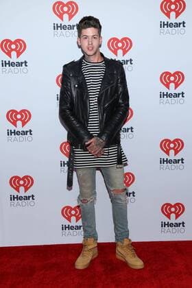 Travis Mills arrives in the press room for the iHeartRadio Music Festival at the MGM Grand Hotel in Las Vegas, Nevada on September 18, 2015.  LAV20150918025 JAMESxATOA