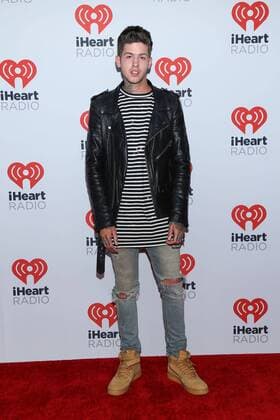 Travis Mills arrives in the press room for the iHeartRadio Music Festival at the MGM Grand Hotel in Las Vegas, Nevada on September 18, 2015.  LAV20150918026 JAMESxATOA