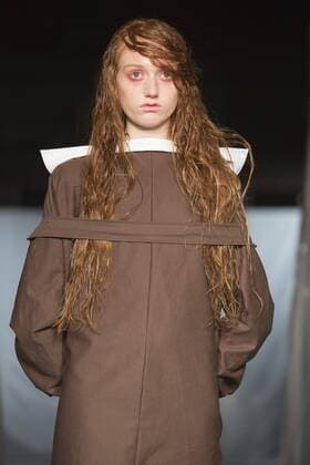 London, UK. 19 09 2015. Runway show of designer James Kelly at Fashion Scout during London Fashion Week. The designs feature moss and fine feathers. London Fashion Week, James Kelly at Fashion Scout, London, UK 