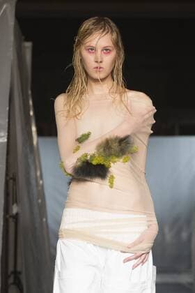 London, UK. 19 09 2015. Runway show of designer James Kelly at Fashion Scout during London Fashion Week. The designs feature moss and fine feathers. London Fashion Week, James Kelly at Fashion Scout, London, UK 