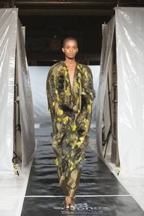 London, UK. 19 09 2015. Runway show of designer James Kelly at Fashion Scout during London Fashion Week. The designs feature moss and fine feathers. London Fashion Week, James Kelly at Fashion Scout, London, UK 